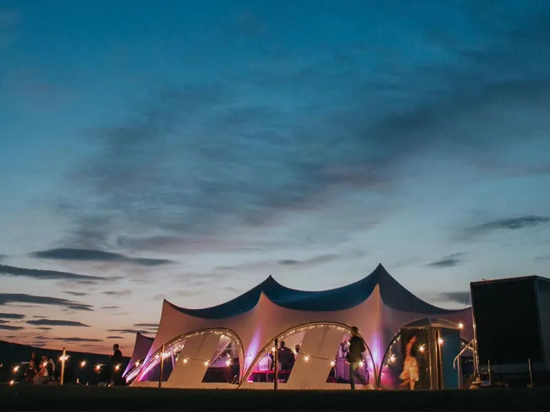 Marquee lit at nightfall at Mary and Mark's wedding