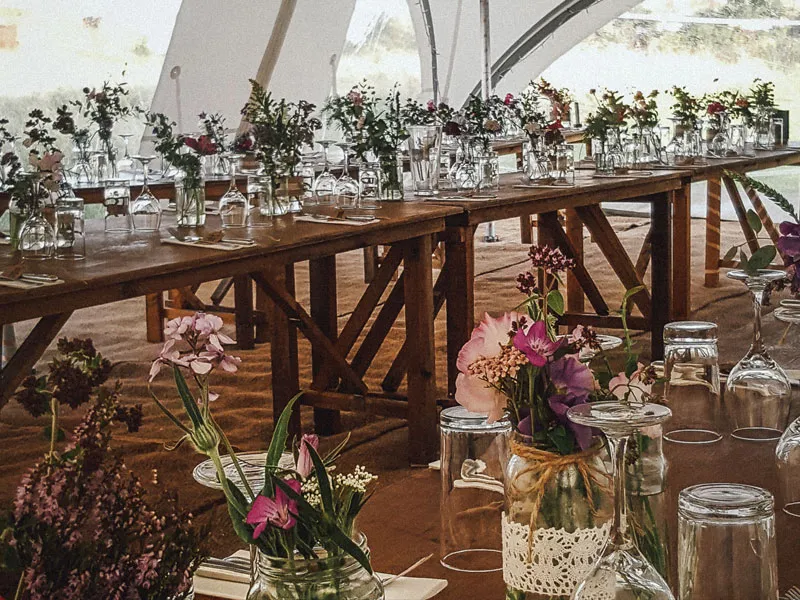 Rustic marquee interior in Sheffield with wooden tables