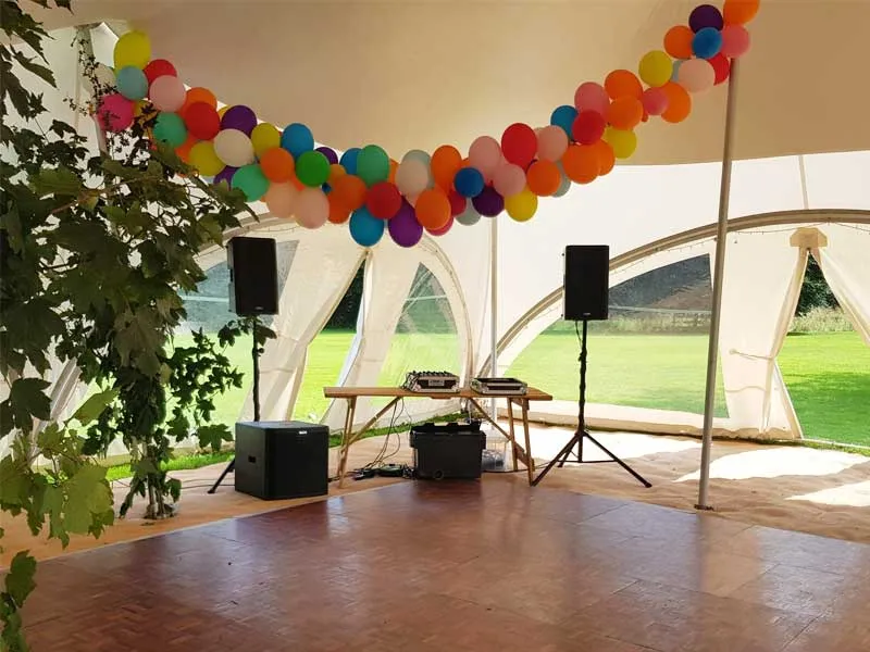 Marquee interior dressed with balloons for a garden party