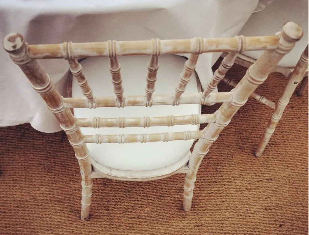Limewash Chiavari chairs with ivory seat pads