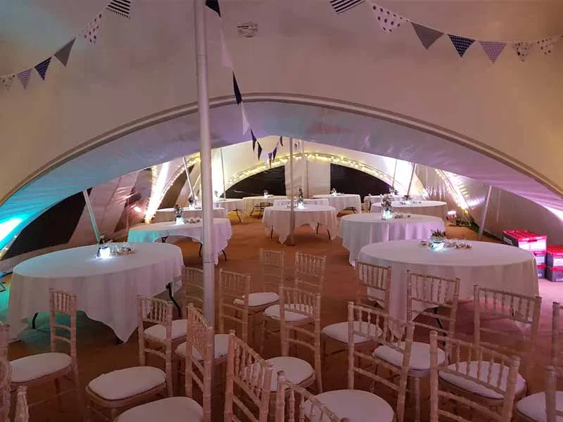 Marquee interior set out for a ceremony at Castleton