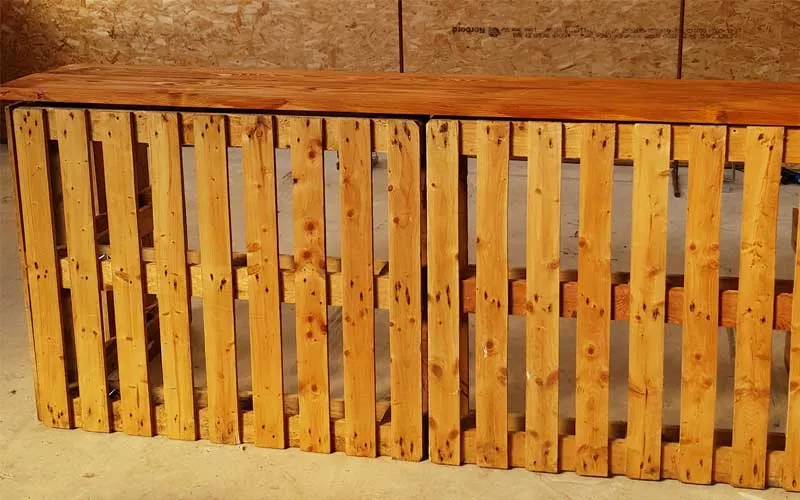 Reclaimed pallet bar with a scaffolding board top