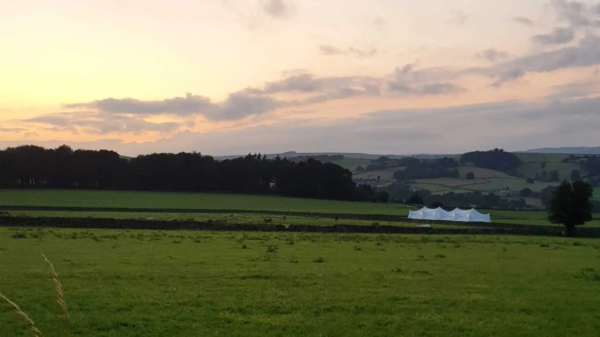 Marquee set up in a field at a Sheffield venue