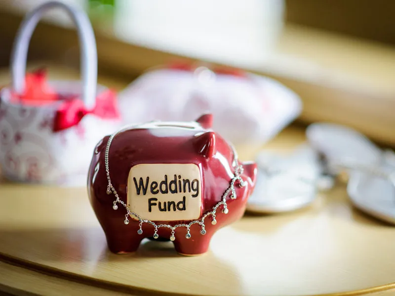 Notebook and wedding budget planning on a table