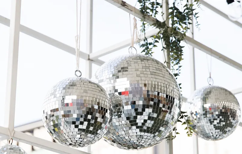 Mirror ball hanging inside a marquee