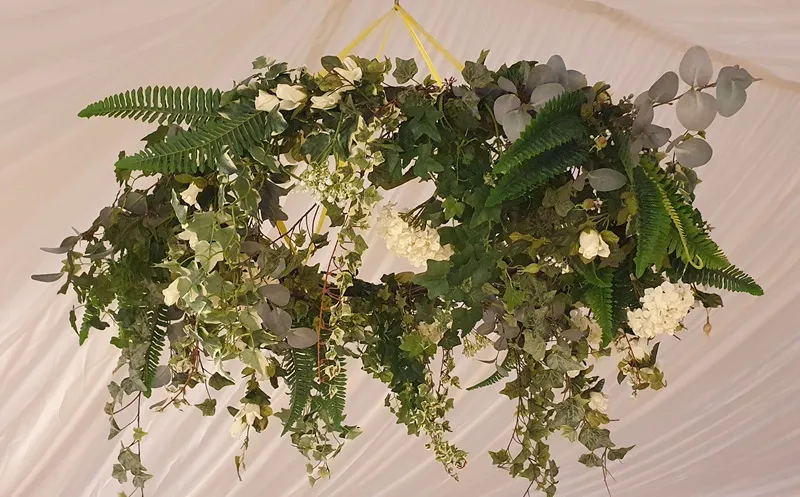 Hanging floral hoop inside a marquee